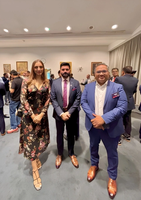Tech leaders and investors networking under modern venue lighting